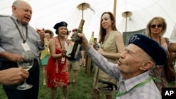 FILE — Mike Grgich of Grgich Hills Estate pours his Paris Tasting anniversary chardonnay in St. Helena, Calif., May 31, 2013. On Wednesday, Grgich died at 100. 