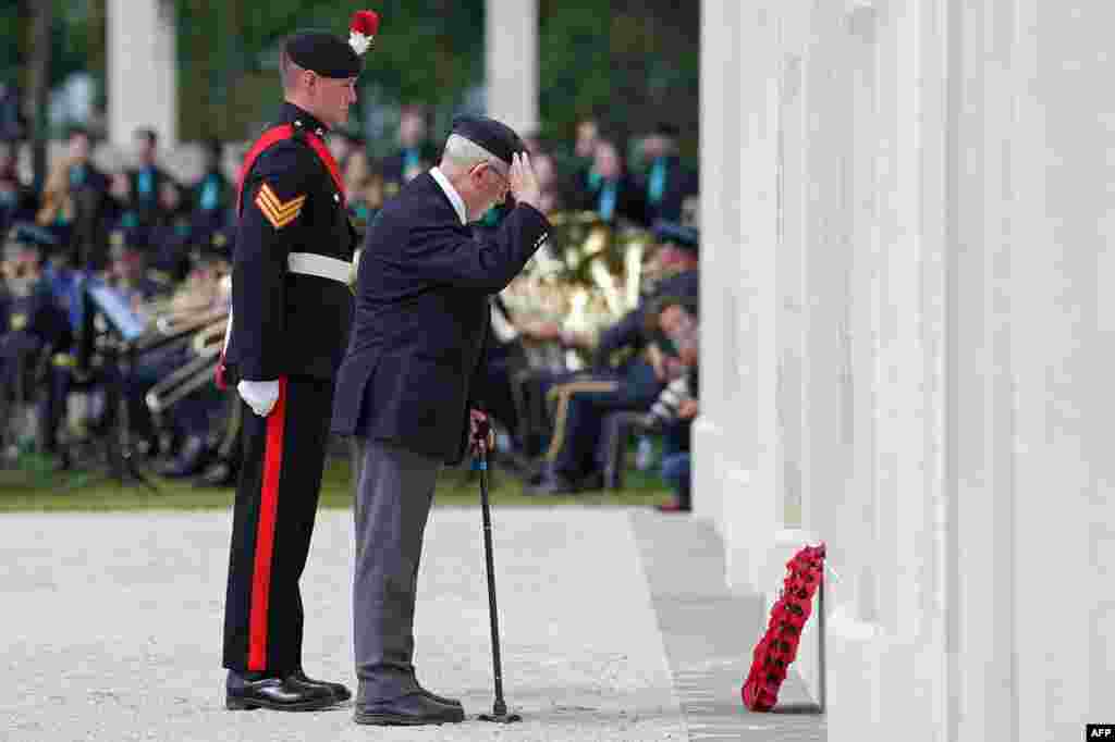 A D-Day veteran lays a wreath during the UK Ministry of Defense and the Royal British Legion&#39;s commemorative ceremony marking the 80th anniversary of the World War II &quot;D-Day&quot; Allied landings in Normandy, at the World War II British Normandy Memorial near the village of Ver-sur-Mer in northwestern France, June 6, 2024.