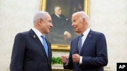 U.S. President Joe Biden, right, meets with Israeli Prime Minister Benjamin Netanyahu in the Oval Office of the White House in Washington, July 25, 2024. 