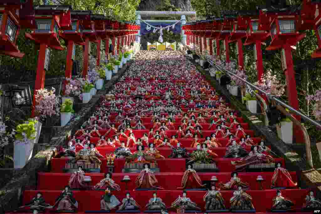 Japanese ornamental dolls (hina dolls) are seen on the steps at Tomisaki shrine during the Katsuura Big Hinamatsuri festival in Katsuura city of Chiba prefecture.