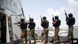 FILE — Ghanaian soldiers conduct close quarter combat drills during Flintlock 2023 on a Spanish frigate at Tema port, Ghana, Thursday, March 9, 2023. 