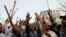 Supporters of former Pakistani Prime Minister Imran Khan chant slogans, after police postpone the arrest of Khan, outside his home in Lahore, Pakistan, March 15, 2023. 
