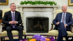 FILE - President Joe Biden, right, meets with House Speaker Kevin McCarthy to discuss the debt limit, in the Oval Office of the White House, in Washington, May 22, 2023.