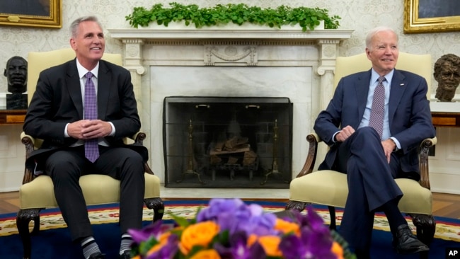 FILE - President Joe Biden, right, meets with House Speaker Kevin McCarthy to discuss the debt limit, in the Oval Office of the White House, in Washington, May 22, 2023.