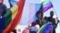 Members of Namibia's LGBTQ community wave rainbow flags during a Pride Parade in the capital Windhoek, July 29, 2017. The country's Supreme Court on March 20, 2023, sided with a lower court in denying a gay couple's citizenship application for foreign-born surrogate child.