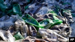 Melted beer bottles are shown in the back of a burnt out truck following the wildfires in Lahaina, Hawaii, Aug. 11, 2023.