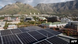 FILE: A general view of solar panels on top of the Hemp Hotel in Cape Town, South Africa, on April 25, 2023. 