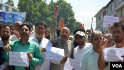 Sheikh Abdul Rashid, center, is a firebrand leader and founder of the Awami Itihad Party on the Indian side of Kashmir. He is known for his unique style of expressing dissent in the region. He is held in New Delhi’s Tihar jail. (Wasim Nabi for VOA)