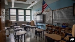 FILE - An empty elementary school classroom is seen on Aug. 17, 2021, in the Bronx borough of New York. 