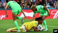 Nigeria's goalkeeper Chiamaka Nnadozie saves a ball during the Women's World Cup round of 16 soccer match between England and Nigeria in Brisbane, Australia, Aug. 7, 2023.