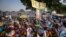 FILE - Women hold await the arrival of Pope Francis at the St. Theresa Cathedral in Juba, South Sudan, Feb. 4, 2023. In December 2024, the country is due to hold presidential elections, the culmination of a 2018 peace agreement.