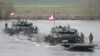 Polish and other NATO troops take part in military maneuvers Steadfast Defender 24 in Korzeniewo, Poland, on March 4, 2024, as the alliance strengthens its defense capabilities on the eastern flank in the face of Russia's war on Ukraine. (AP Photo/Czarek Sokolowski)