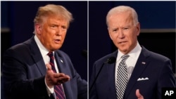 资料照片：在俄亥俄州克利夫兰凯斯西储大学所举行的2020年美国总统选举第一场总统辩论，左为共和党候选人唐纳德·特朗普，右为民主党候选人乔·拜登。