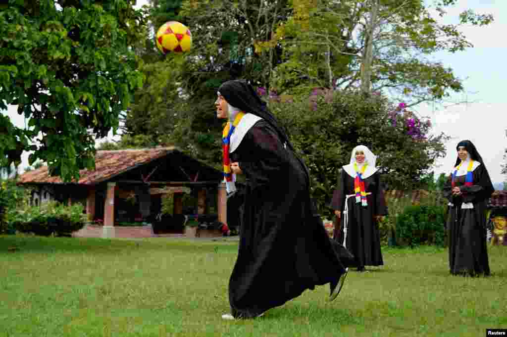 Poor Clare Sisters play soccer as they support the Colombian national team in the Copa America final against Argentina, at a convent in Montenegro, Colombia, July 13, 2024. 