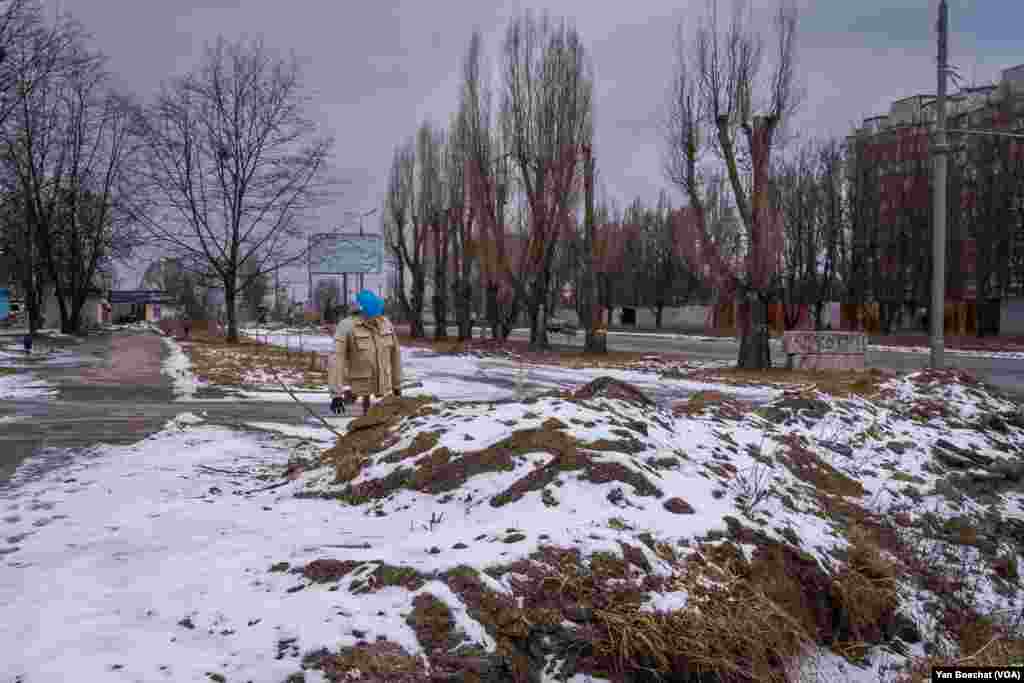 A dummy used by the Ukrainian forces to fool Russian snipers stands in Saltivka, a residential district in Kharkiv hit hard by the Russian artillery, Feb. 15, 2023.