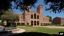 Children play outside Royce Hall at the University of California, Los Angeles, campus in Los Angeles, Aug. 15, 2024. 