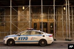 NYPD vehicles parked outside District Attorney's office in New York, March. 29, 2023. The Manhattan grand jury investigating former President Donald Trump over hush money payments had returned to hear more evidence.