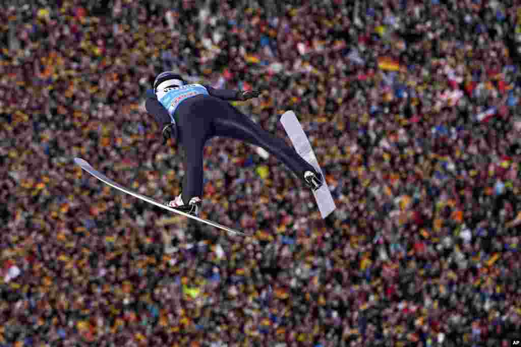 Andreas Wellinger of Germany soars through the air during his first round jump at the second stage of the 72th Four Hills ski jumping tournament in Garmisch-Partenkirchen, Germany.