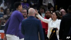 Phoenix Mercury center Brittney Griner (42) is greeted by Vice President Kamala Harris before a WNBA basketball game in Los Angeles, May 19, 2023.