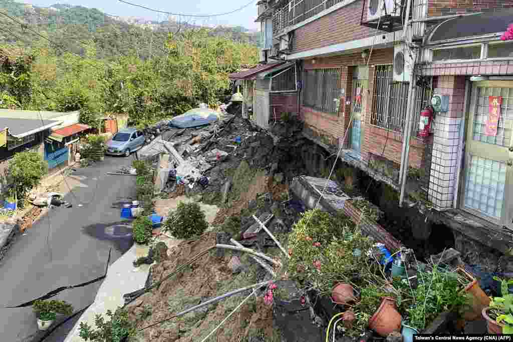 This photo taken by Taiwan's Central News Agency (CNA) on April 3, 2024 shows damage to buildings in Xindian district of New Taipei City, after a major earthquake hit Taiwan's east. 