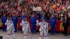 Chinese astronauts for the Shenzhou-18 mission, from left, Li Guangsu, Li Cong and Ye Guangfu, wave as they attend a send-off ceremony for their manned space mission at the Jiuquan Satellite Launch Center in northwestern China, April 25, 2024. 