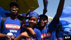 FILE - Supporters of the South African opposition party Democratic Alliance (DA) react during the DA's manifesto launch at the Union Buildings in Pretoria, on Feb. 17, 2024. 