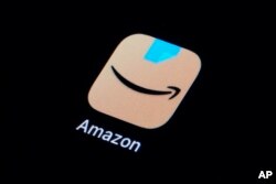 FILE - The Amazon app icon is seen on a smartphone, Tuesday, Feb. 28, 2023, in Marple Township, Pa. Google, Facebook,