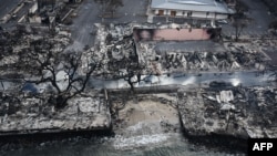 An aerial image taken Aug. 10, 2023, shows destroyed homes and buildings on the waterfront burned to the ground in Lahaina in the aftermath of wildfires in western Maui, Hawaii. 