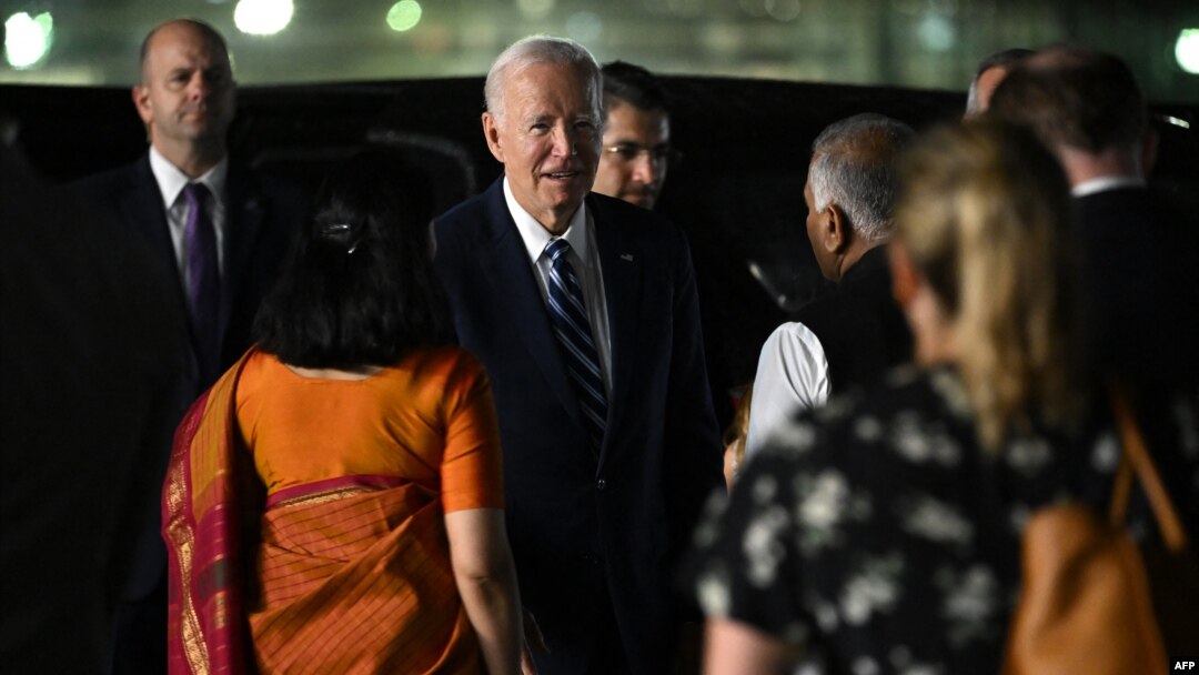 U.S. President Joe Biden, center, arrives at the airport on the eve of the two-day G20 summit in New Delhi on Sept. 8, 2023.