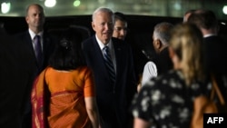 U.S. President Joe Biden, center, arrives at the airport on the eve of the two-day G20 summit in New Delhi on Sept. 8, 2023.