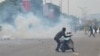 FILE - Police fired tear gas during a protest in Abuja, Aug. 1, 2024. Nigeria’s leader on Aug. 4, called for an end to mass protests against the West African nation’s economic hardship. 