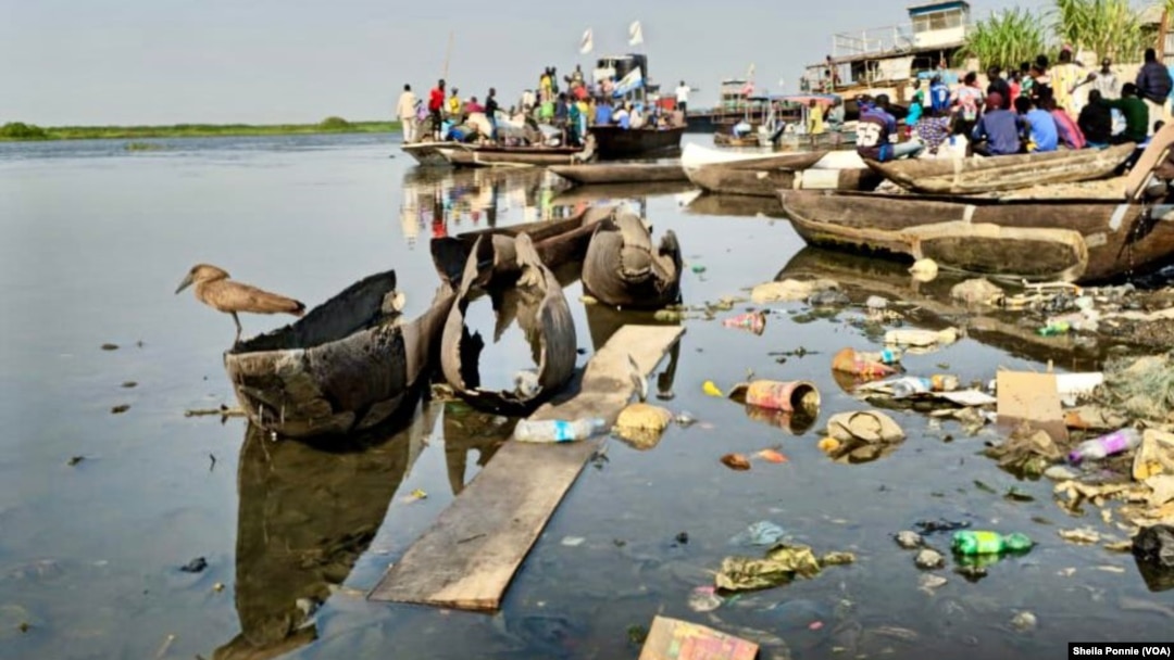Trash and rotten boards litter the Nile River, in Bor, Jonglei State, South Sudan.