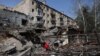 A person looks through the rubble of a building destroyed by bombing in the town of Kostyantynivka, Donetsk region, on April 11, 2024.