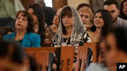 Iraqi Christians attend Easter religious services at Mar Youssif Chaldean Church in Baghdad, Apr. 9, 2023. 