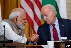 FILE - President Joe Biden speaks with India's Prime Minister Narendra Modi during a meeting with American and Indian business leaders in the East Room of the White House, June 23, 2023, in Washington.