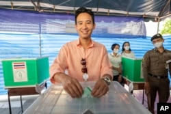 Leader of Move Forward Party Pita Limjaroenrat poses as he casts his vote during a general election at a polling station in Bangkok, Thailand, May 14, 2023.