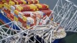 FILE - Aerial view of the Dali cargo vessel which crashed into the Francis Scott Key Bridge, causing it to collapse in Baltimore, Maryland, March 26, 2024.