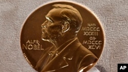 FILE - A Dec. 8, 2020, photo of a Nobel Prize medal displayed during a ceremony in New York.