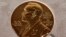 FILE - A Dec. 8, 2020, photo of a Nobel Prize medal displayed during a ceremony in New York.