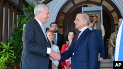 In this photo released by Pakistan's Prime Minister Office, the U.N. High Commissioner for Refugees, Filippo Grandi, left, shakes hand with Pakistan's Prime Minister Shehbaz Sharif after their meeting in Islamabad, Pakistan, July 9, 2024.