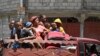 Haiti Aid Groups Halt Operations as Thousands Flee Gang Warfare 