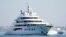 FILE - The superyacht Amadea sails into the San Diego Bay on June 27, 2022. The $325 million superyacht was seized by the United States from a sanctioned Russian oligarch.