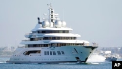 FILE - The superyacht Amadea sails into San Diego Bay, June 27, 2022, as seen from Coronado, California. The U.S. wants to sell the confiscated vessel, which it says belongs to a sanctioned Russian oligarch.