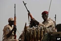 FILE - Sudanese soldiers from the Rapid Support Forces in the East Nile province, Sudan, June 22, 2019.