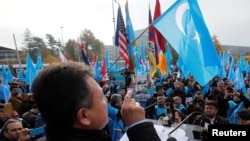 FILE - Dolkun Isa, president of the World Uyghur Congress, gestures as he speaks during a demonstration against China, in Geneva, Switzerland, Nov. 6, 2018. The World Uyghur Congress has been nominated for the 2023 Nobel Peace Prize. 