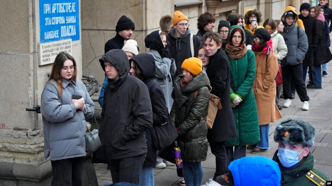 Voters queue at a polling station in St. Petersburg, Russia, March 17, 2024.