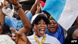 All Progressives Congress (APC) party supporters celebrate in Lagos on March 1, 2023 after party candidate Bola Tinubu won Nigeria's highly disputed weekend election.