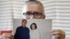 Taghi Ramahi, husband of Narges Mohammadi, a jailed Iranian women's rights advocate, who won the 2023 Nobel Peace Prize, poses with an undated photo of himself and his wife, in Paris, France, October 6, 2023.