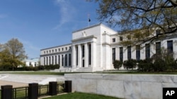FILE: The U.S. Federal Reserve Bank Building, home to the Board of Governors of the Federal Reserve System, is seen in Washington, Friday, April 25, 2014. Often referred to as "The Fed," it is the nation's central banking system and sets monetary policy for the United States. 
