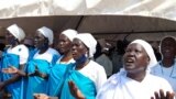 FILE - South Sudanese women living in a camp for internally displaced pray for peace during a visit by First Vice President Riek Machar in Juba, South Sudan, Feb. 26, 2023.